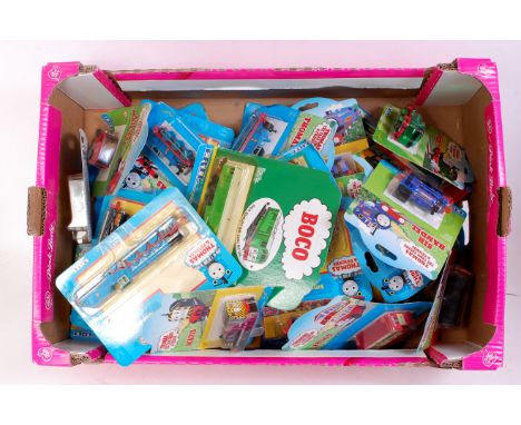 42 various carded ERTL Thomas the Tank Engine diecast locomotives and accessories to include Thomas, Gordon, Mavis, Ben, and 