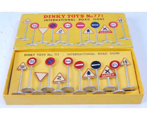 A Dinky Toys No. 771 International Road Sign set comprising 12 various road signs in the original lift-off lid tray type box 