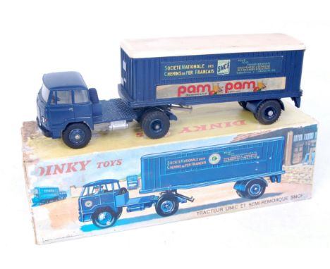 A French Dinky Toys No. 083 articulated lorry "SNCF", comprising dark blue cab and trailer with plastic dark blue hubs, cream
