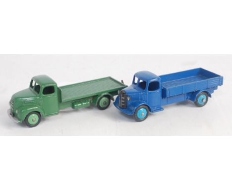 A Dinky Toys loose commercial group, two examples to include No. 422 Ford Thames flat truck finished in green with mid green 