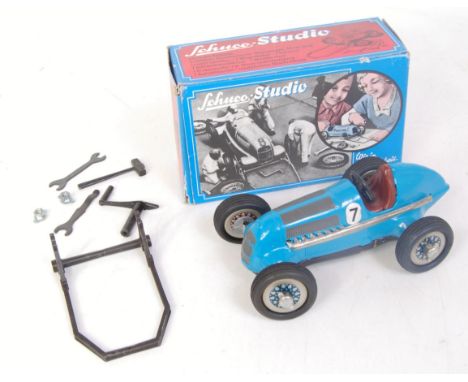 A Schuco No. 1050 tinplate and clockwork Mercedes Grand Prix 1936 racing car, comprising blue and black body  with racing No.