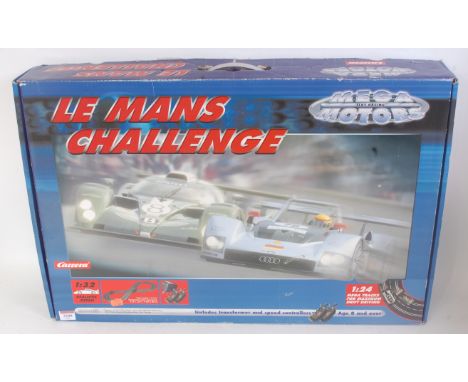 A Carrera Megaslot Racing Le Mans Challenge boxed set, 1/32 scale, appears complete, comprising 2x cars, various track, throt