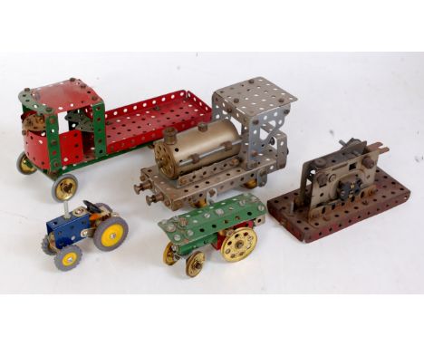 Five various home built Meccano models to include an 0-4-0 steam locomotive, a miniature scale tractor, and a four wheel cloc