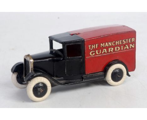 A Dinky Toys pre-war type 1 delivery van Manchester Guardian comprising black and red body with black cast hubs and replaceme