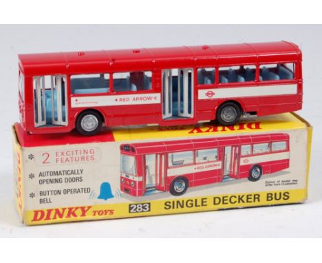 A Dinky Toys No. 283 Red Arrow single decker bus comprising red body with light blue interior, white doors with white base pl