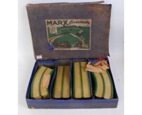 A Louis Marx Company tinplate and clockwork boxed Speedway set missing one car with various green and yellow tinprinted detai