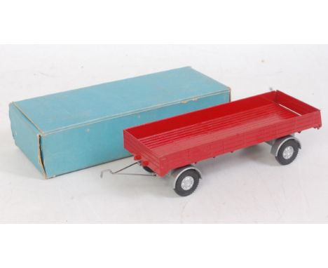A Spot-On Models No. CB106 four wheel trailer comprising red body and silver mud guards with detailed cast hubs, with draw ba