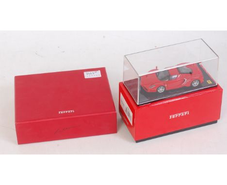 A 1/43 scale boxed Ferrari diecast group to include a Kyosho 1/43 scale Ferrari Enzo model No. 05001T, sold with an Ixo Model