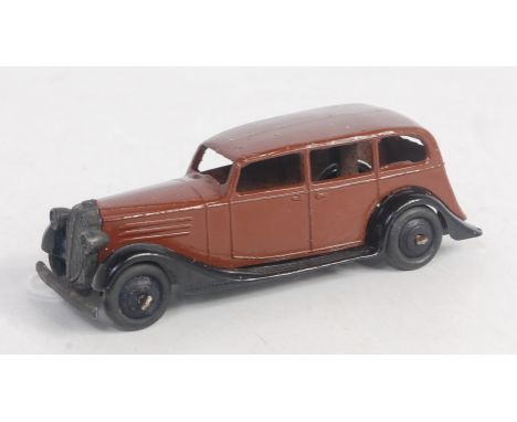 A Dinky Toys No. 30D Vauxhall comprising closed chassis with brown body and black chassis and rigid hubs (VG-NM)