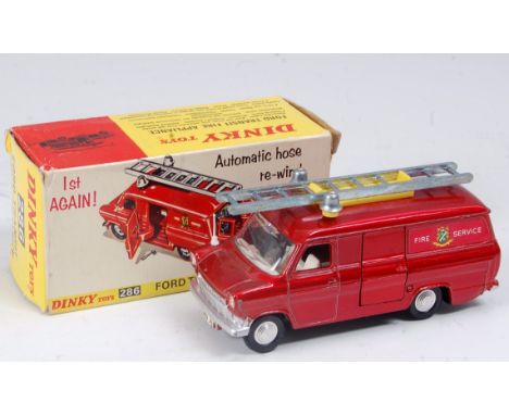 A Dinky Toys No. 286 Ford Transit fire appliance comprising metallic red body with white interior and flat spun hubs, in the 