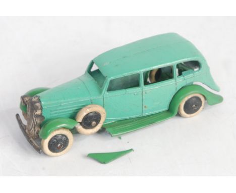 A Dinky Toys pre-war 30D Vauxhall Saloon comprising light green body with mint green chassis, smooth black hubs and white tyr