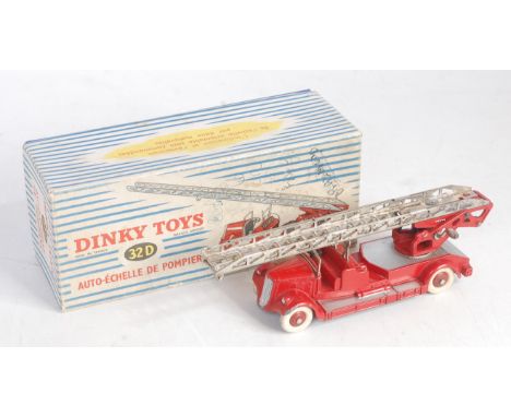 A French Dinky Toys No. 32D Auto-Echelle de Pompiers fire engine comprising red and silver body with red hubs and white tyres