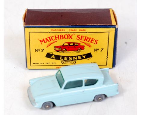 A Matchbox 1-75 series No. 7B Ford Anglia comprising light blue body with grey plastic wheels in the original type B all card