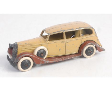 A Dinky Toys pre-war No. 30D Vauxhall comprising tan body with brown open chassis, with black hubs and white tyres, spare whe