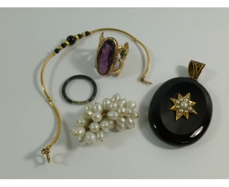 A Victorian gold mounted onyx and half pearl mourning locket with keepsake hair filled panel to the reverse, 6cm long, an ele