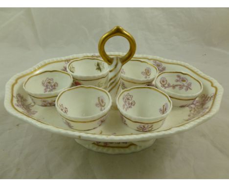An H & R Daniel porcelain egg cup stand, second gadroon shape, with printed maroon flowers and gilt detail numbered 4141 in r