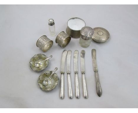 A pair of silver trinket dishes, London 1894, by William Comyns, 6.25cm diameter, two silver topped glass jars, a pair of sil