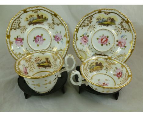 An H & R Daniel porcelain teacup and saucer and coffee cup and saucer, second gadroon shape, hand painted with landscapes of 