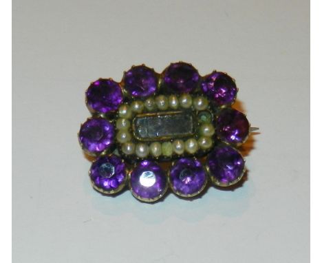 A Georgian gold, amethyst and half seed pearl mourning brooch, of cushion form, the centre containing a small glazed plaited 