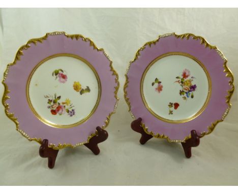 A pair of H & R Daniel porcelain dessert plates, Shrewsbury shape, with pink borders, hand painted with floral sprigs and spr