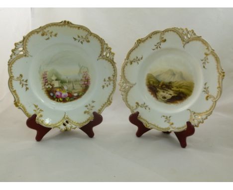 Two H & R Daniel porcelain plates, Pierced or Queens shape, with gilt detail and decorated to the centre with a river landsca