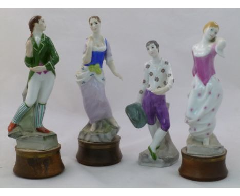 A set of four modern Royal Worcester porcelain figures, raised on turned wooden plinths (one lacking), two entiteld 'Delia' a