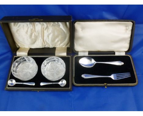 A silver christening fork and spoon, Birmingham 1937, cased, and  a pair of early 20th century cut glass salts with a pair of