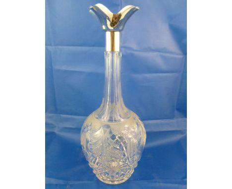 A George V cut crystal decanter with silver collar, Sheffield 1934, stopper lacking, 30cm high