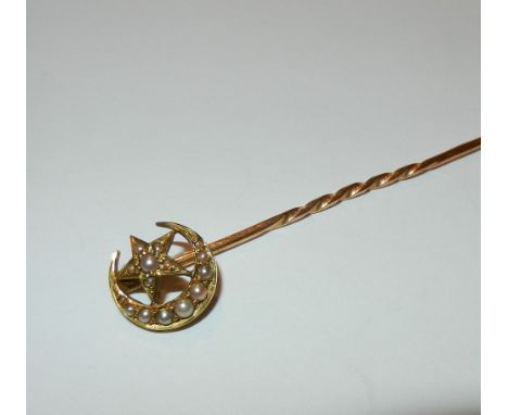 A Victorian 9 carat gold crescent moon and star stick pin set with half seed pearls, stamped '9Ct' to the shank, 6.5cm long, 