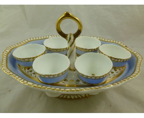 An H & R Daniel porcelain egg cup stand, second gadroon shape, with lilac blue border and gilt detail, numbered 4332 in gilt 