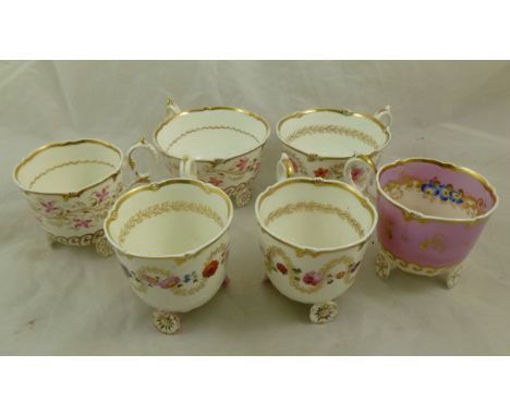 Four H & R Daniel porcelain coffee cans and two tea cups, all C scroll shape, three hand painted with a trailing band of flow