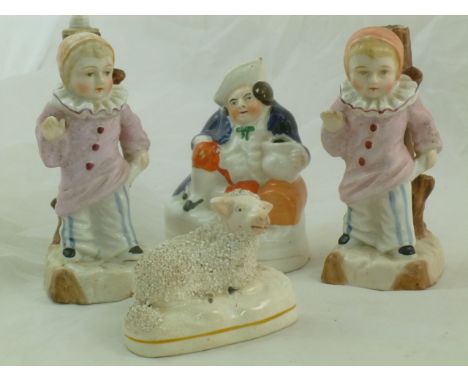 A Staffordshire model of a sheep and a Staffordshire pottery 'Toby' inkwell/pen holder and a pair of Continental porcelain fi