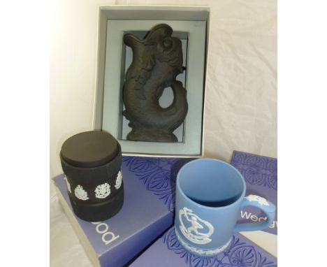 A Wedgwood blue jasperware tankard decorated with an Olympiad and Canada's Coat of Arms, with original box, a Wedgwood black 