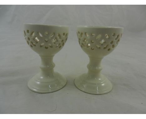 A pair of Creamware egg cups, possibly by Hartley Greens and Co. of Leeds, with pierced decoration, unmarked, 6.5cm high - Pa