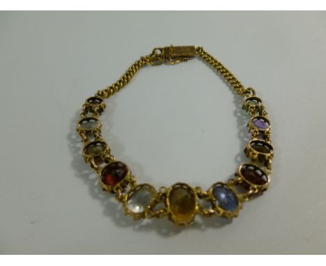 A Victorian gold eleven stone multigem bracelet, set with zircons, topaz, spinel, garnet, sapphire and amethyst, unmarked, 7.