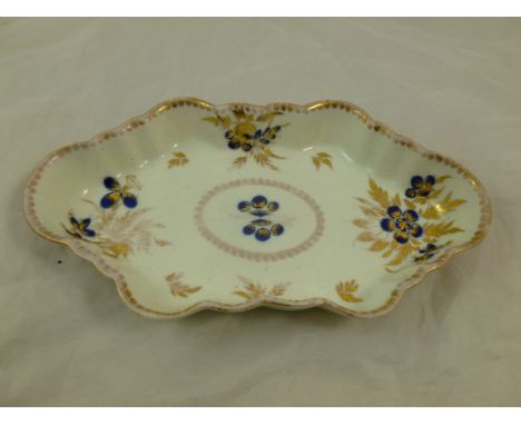 An 18th century porcelain spoon tray, First period Worcester, of elongated hexagonal form, decorated with underglaze blue and