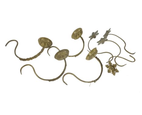 An unusual part brass candelabrum,probably Dutch, 18th century, having four arms with pricket candlestick sconces and four ar