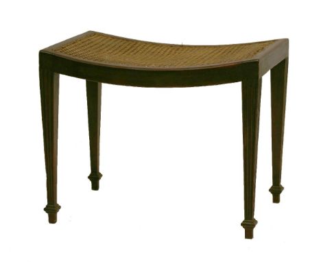 A Sheraton-style mahogany stool,with a dished caned seat on square tapering fluted legs,55cm wide45.5cm high