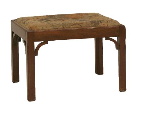 A rectangular mahogany stool,18th century, with a tapestry upholstered seat, on square chamfered legs and curved corner brack