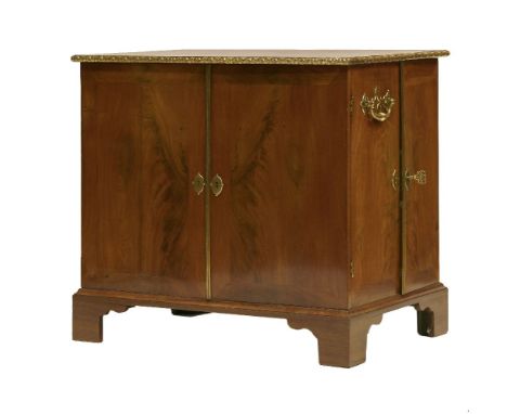 An unusual George III free-standing mahogany gentleman's library/collecting cabinet,the top with an applied cast and gilt met