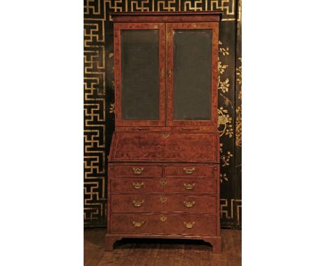 In the manner of John Channon,a good figured walnut bureau bookcase,mid 18th century, the top section with a moulded cornice 