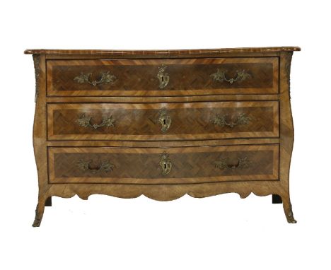 An Italian walnut and kingwood commode,18th century, of three long drawers, the top and drawer fronts with chequered inlay, w