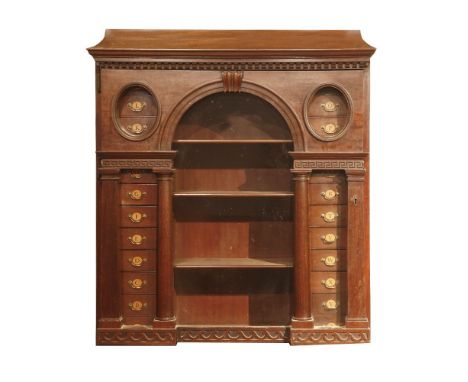 A George III mahogany cabinet,of architectural form, with moulded dentil cornice over a door with central glazed arch, flanke