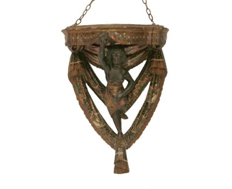 A Venetian polychrome and gilt wall bracket,18th/19th century, the serpentine front with painted drapery beneath and supporte