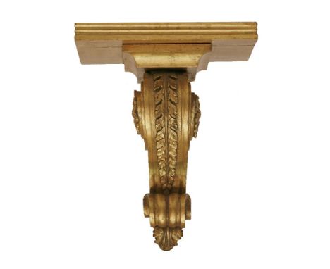 A carved and giltwood wall bracket,34cm high