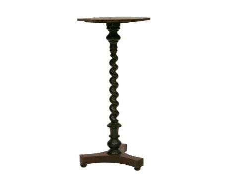 A torchŠre,the strung rosewood top on a twist turned column and triform rosewood base,71cm high