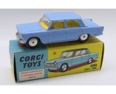 Corgi Toys - A boxed Corgi Toys #217 Fiat 1800. The model in light blue, lemon interior with spun hubs, has some nicks along 