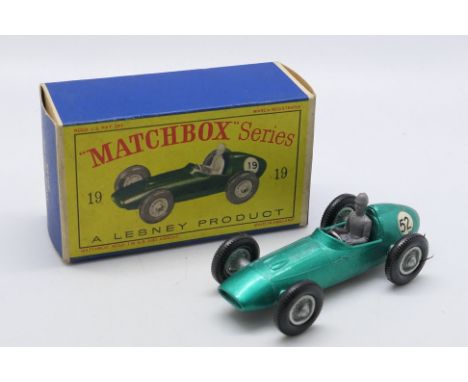 Matchbox - Unsold Shop Stock - A boxed Aston Martin DBR5 in metallic green # 19. The car has the rarer racing number 52 and i