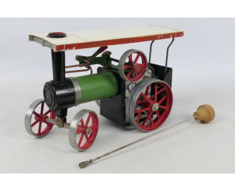 Mamod - An unboxed Mamod TE1 steam traction engine. The model comes with burner, skuttle, and steering rod, and has some play