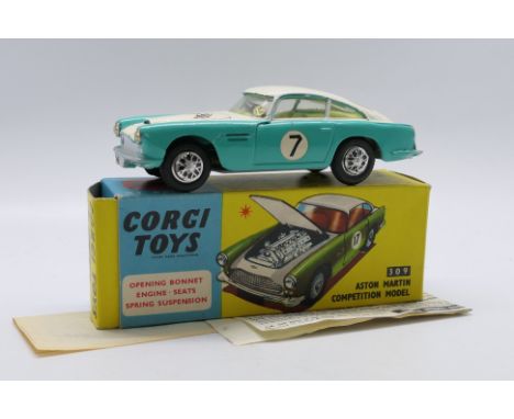 Corgi Toys - A boxed Corgi Toys #309 Aston Martin Competition Model. The model with turquoise / white body with RN7 decals le